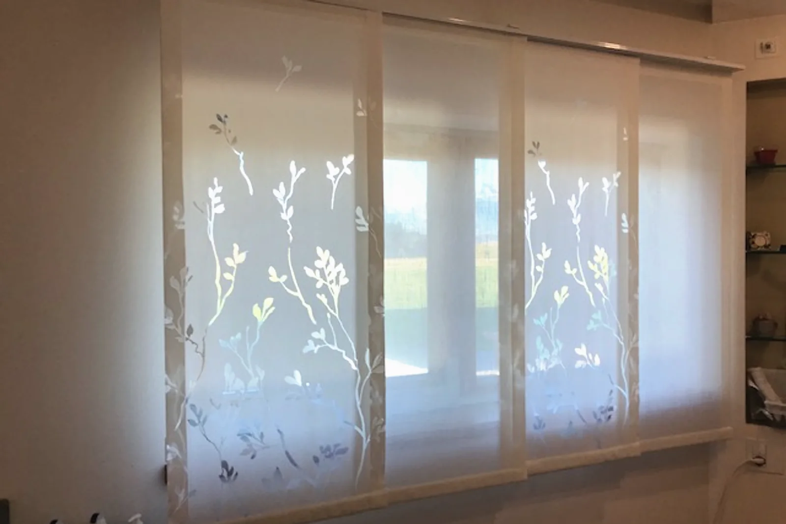 Panel curtain in a patterned fabric, bathroom area
