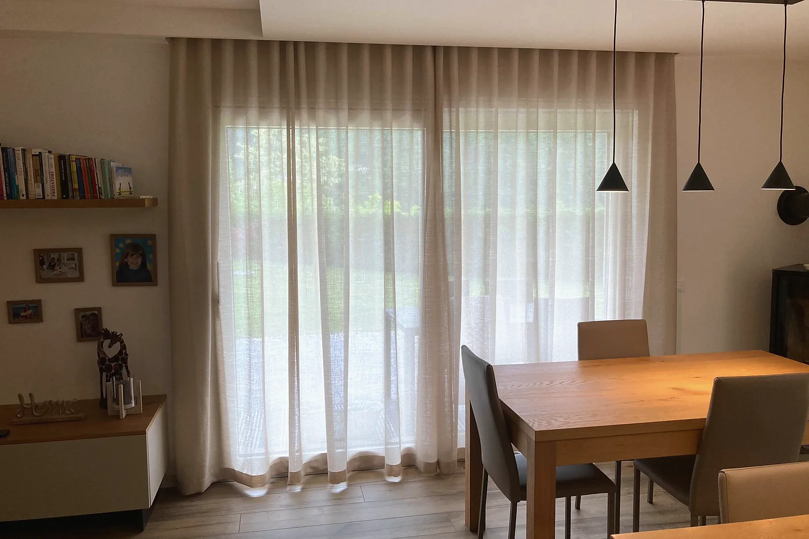 Wave-pleat sheers across a garden door, dining room