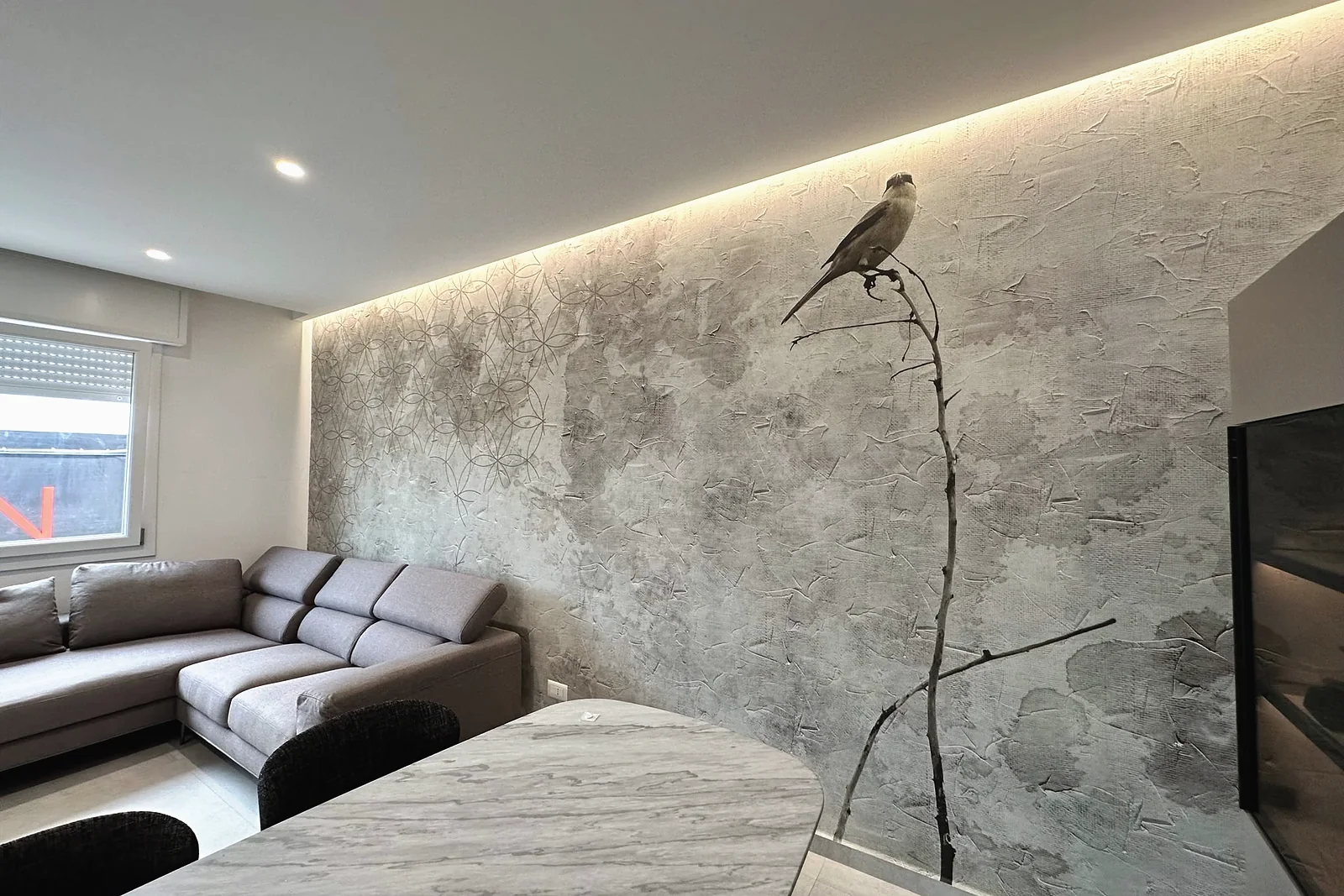Magnolia wallpaper on a concrete ground, media wall